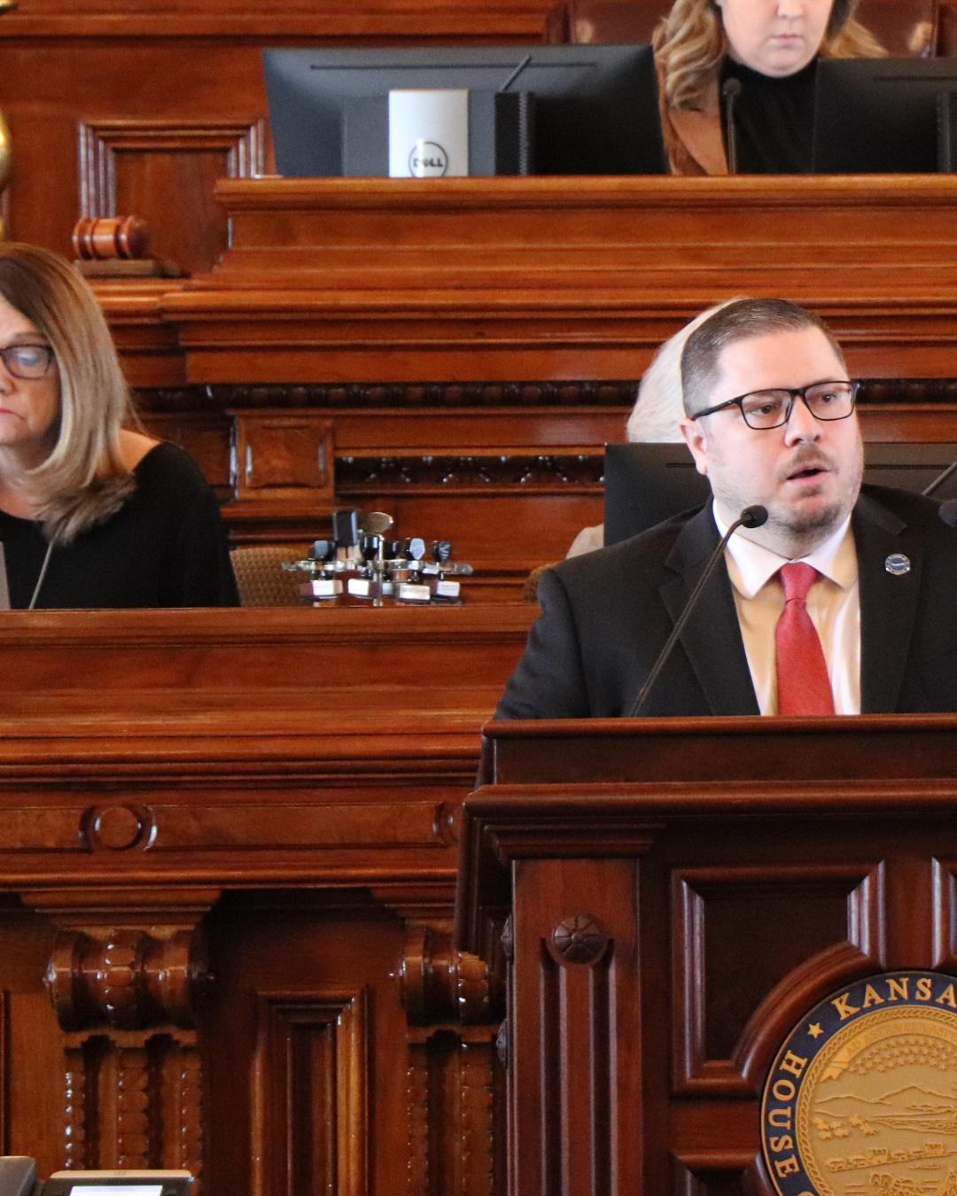 Nick Hoheisel speaking from the podium in the Kansas House